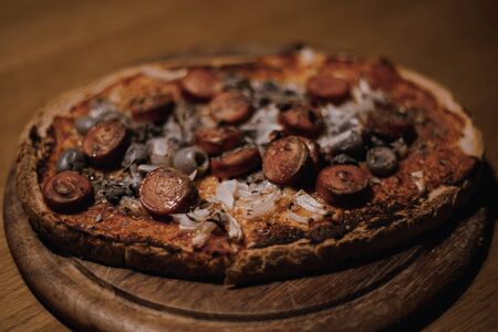 Blackcolor effect of bruschetta with olives, frankfurters and onionsの写真素材