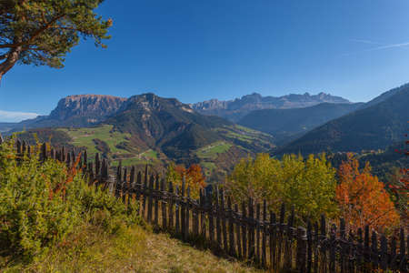 Autumn panorama of the Val di Tires with the Sciliar and the Catinaccio peaks in the background, Italy. Concept: autumnal Dolomite landscapesの写真素材