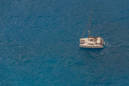 Catamaran sailing on a turquoise sea, Zakynthos island, Greeceの写真素材
