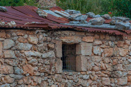 Old stone building with tin roof, Zakynthos island, Greeceの写真素材