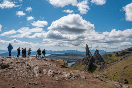 ISLE OF SKYE, GREAT BRITAIN - MAY 30, 2019: people watching typical Old man of Storr rock formationのeditorial素材