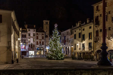 View on Christmas tree in medieval town square, Vittorio Veneto, Italyの写真素材