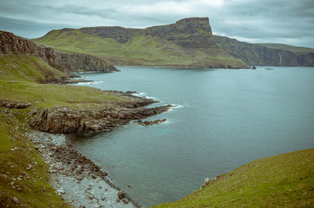 Bay and cliffs on the Isle of Skye. Concept: travel in Scotland, typical Scottish landscapes, places of charm and mysteryの写真素材