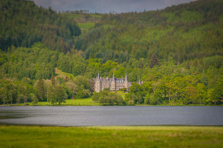 Tilt shift effect of ancient manor of Mor Trossachs, facing Loch Achray, Scotland. Concept: travel to Scotland, typical landscapes of Scotlandのeditorial素材