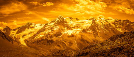 Fantasy golden color effect of the Palla Bianca massif surrounded by glaciers, Vallelunga, Alto Adige - Sudtirol, Italy. Popular travel destination. Abstract imageの写真素材