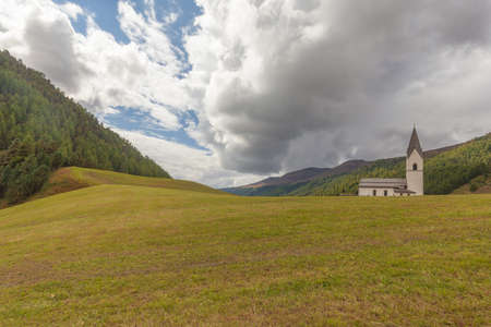 Isolated traditional church in a South Tyrolean valley, Vallelunga Langtauferの写真素材