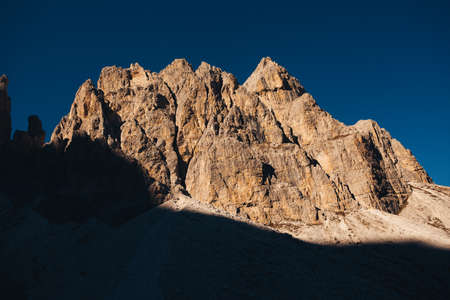 Rocky walls illuminated by the last rays of the sun in Comelico Regionの写真素材