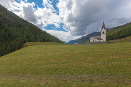Isolated traditional church with cemetery in a South Tyrolean valley, Vallelungaの写真素材