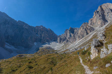 Path at the foots of rocky ridges of Croda Rossa di Sesto Mountainの写真素材