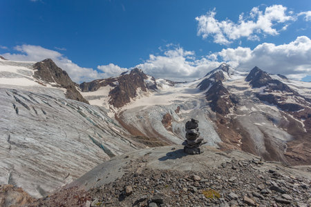 Stones signal with Gepatschferner and Palla Bianca peaks glaciers backgroundの写真素材