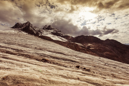 Panorama of Vallelunga Glacier steep surface dominated by snow-capped peaksの写真素材