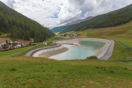 Small alpine village and small artificial lake in Vallelunga, Alto Adige, Italyの写真素材