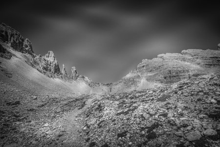 Black and white view of path towards the Forcella dei Campanili, Latemar, Italyの写真素材