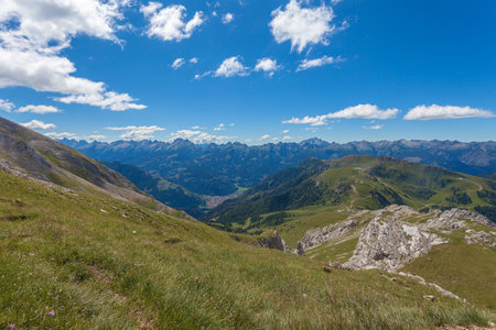 Spectacular summer panorama of the Fiemme Valley surrounded by numerous peaksの写真素材