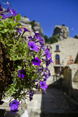 A narrow street among the old houses of Castelmezzano, a medieval village in the Basilicata region,...