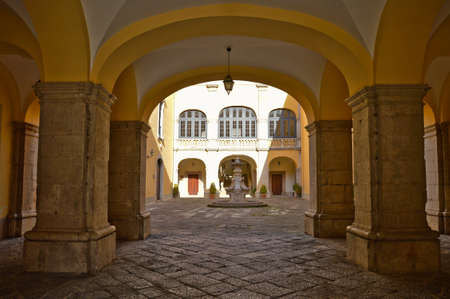 Entrance into the inner courtyard of the Bishop's Palace of Melfi, an old town in the Basilicata region, Italy.のeditorial素材
