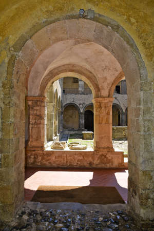 Arches in the inner courtyard of a monastery, now a historical museum, in Altomonte, a rural village in the Calabria region, Italy.のeditorial素材