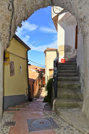 A narrow street among the old houses of MaierÃ , a rural village in the Calabria region, Italy.の写真素材