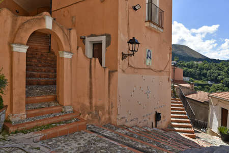A narrow street among the old houses of MaierÃ , a rural village in the Calabria region, Italy.の写真素材