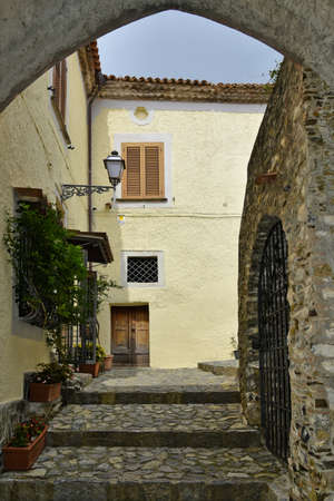 A narrow street among the old houses of Scalea, a medieval village in the Calabria region, Italy.の写真素材