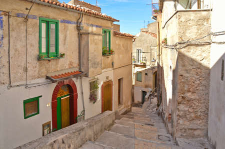 A narrow street among the old houses of Castelcivita, a medieval village in the Campania region, Italy.の写真素材