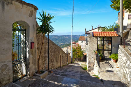 A narrow street among the old houses of Castelcivita, a medieval village in the Campania region, Italy.の写真素材