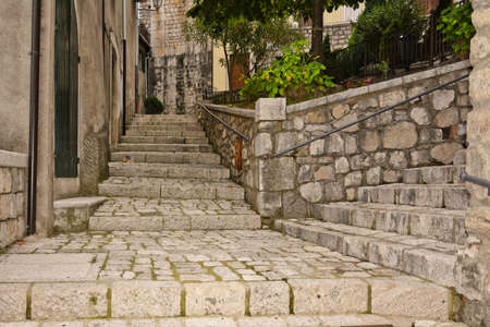 A narrow street among the old houses of Cusano Mutri, a medieval village in the Campania region, Italy.の写真素材