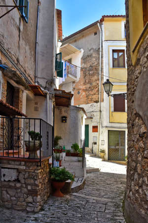 A narrow street among the old houses of Maranola, a medieval village in the Lazio region, Italy.の写真素材