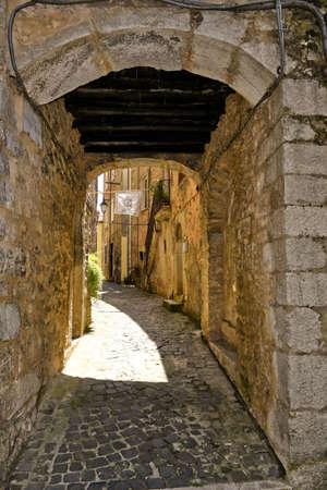 A narrow street among the old houses of Vallecorsa, a medieval village in the Lazio region, Italy.の写真素材