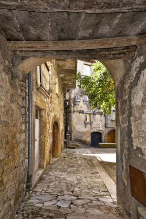 A narrow street among the old houses of Vallecorsa, a medieval village in the Lazio region, Italy.の写真素材