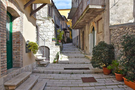 A narrow street among the old houses of Civitanova del Sannio, a medieval village in the Molise region, Italy.の写真素材