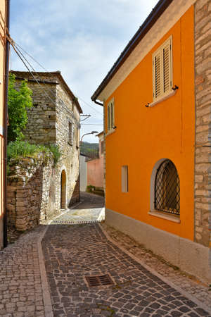 A narrow street among the old houses of Macchiagodena, a medieval town in the Molise region, Italy.の写真素材