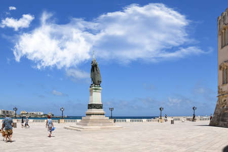 A statue on the seafront in Otranto, an old town in the Puglia region, Italy.の写真素材