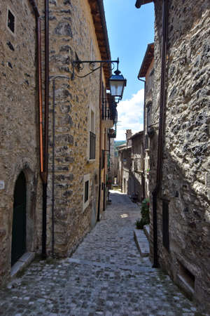 A narrow street among the old houses of Barrea, a medieval village in the Abruzzo region.の写真素材