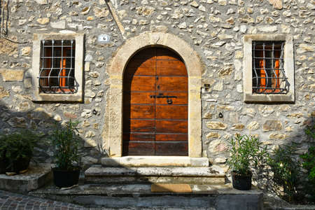 The door of an old house in Castrovalva, a village in the mountains of the Abruzzo region, Italy.の写真素材
