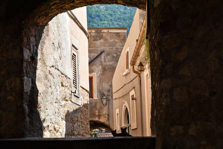A narrow street among the old houses of Villalago, a medieval village in the Abruzzo region.の写真素材