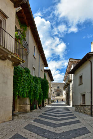 A narrow street among the old houses of Pescocostanzo, a medieval village in the Abruzzo region.の写真素材