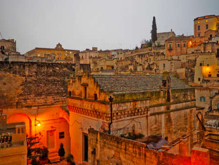 A narrow street among the old houses of Matera, a very ancient city in the Basilicata region, Italy.