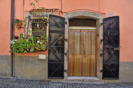 Entrance door of a rural house in Melfi, an old town in the Basilicata region, Italy.のeditorial素材