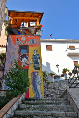 A narrow street among the old houses of Sant'Angelo le Fratte, a medieval village in the Basilicata region.のeditorial素材