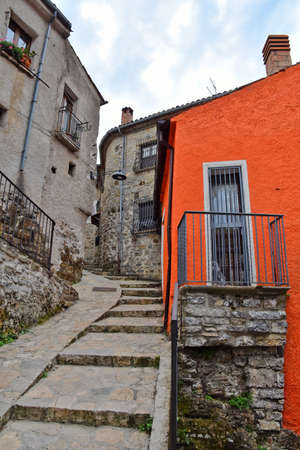 A narrow street among the old houses of Sasso di Castalda, a medieval village in the Basilicata region.の写真素材