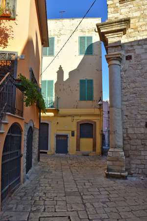 A narrow street among the old houses of Venosa, a medieval village in the Basilicata region.