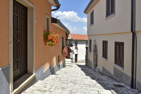 A narrow street among the old houses of Cairano, a medieval village in the Campania region.の写真素材
