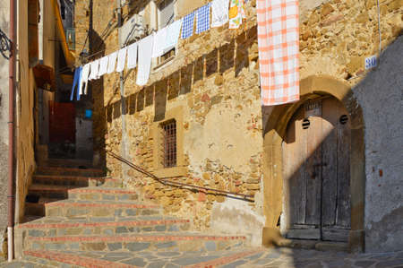 A narrow street among the old houses of Altavilla Silentina, a medieval village in Salerno province.の写真素材