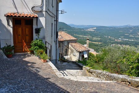 A narrow street between the stone houses of Morcone, an old town in the province of Benevento.のeditorial素材