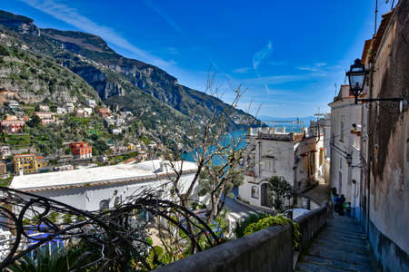 Positano, Italy, 03/30/2018. A narrow street between the Mediterranean-style houses of a town on the Amalfi coast.のeditorial素材