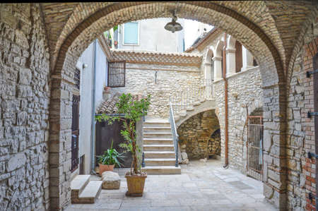 Venosa, Italy, 09/16/2017. The inner courtyard of a medieval village in the Basilicata region.のeditorial素材