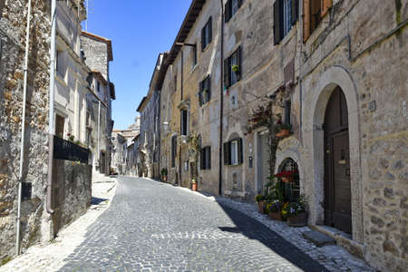 Sermoneta, Italy, 05/10/2021. A street between old medieval stone buildings in the historic town.のeditorial素材