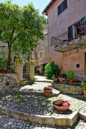 Sermoneta, Italy, 05/10/2021. A street between old medieval stone buildings in the historic town.のeditorial素材