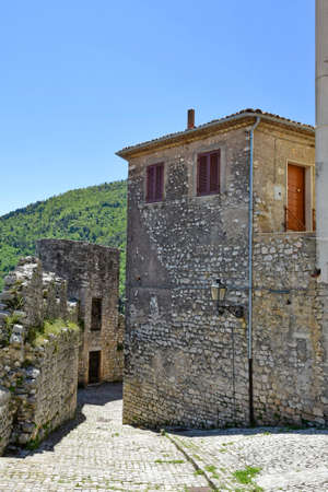 Bassiano, Italy, 05/10/2021. A narrow street between the stone buildings of a medieval town in the Lazio region.のeditorial素材